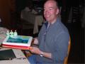 The cake is about to be cut at the celebration dinner